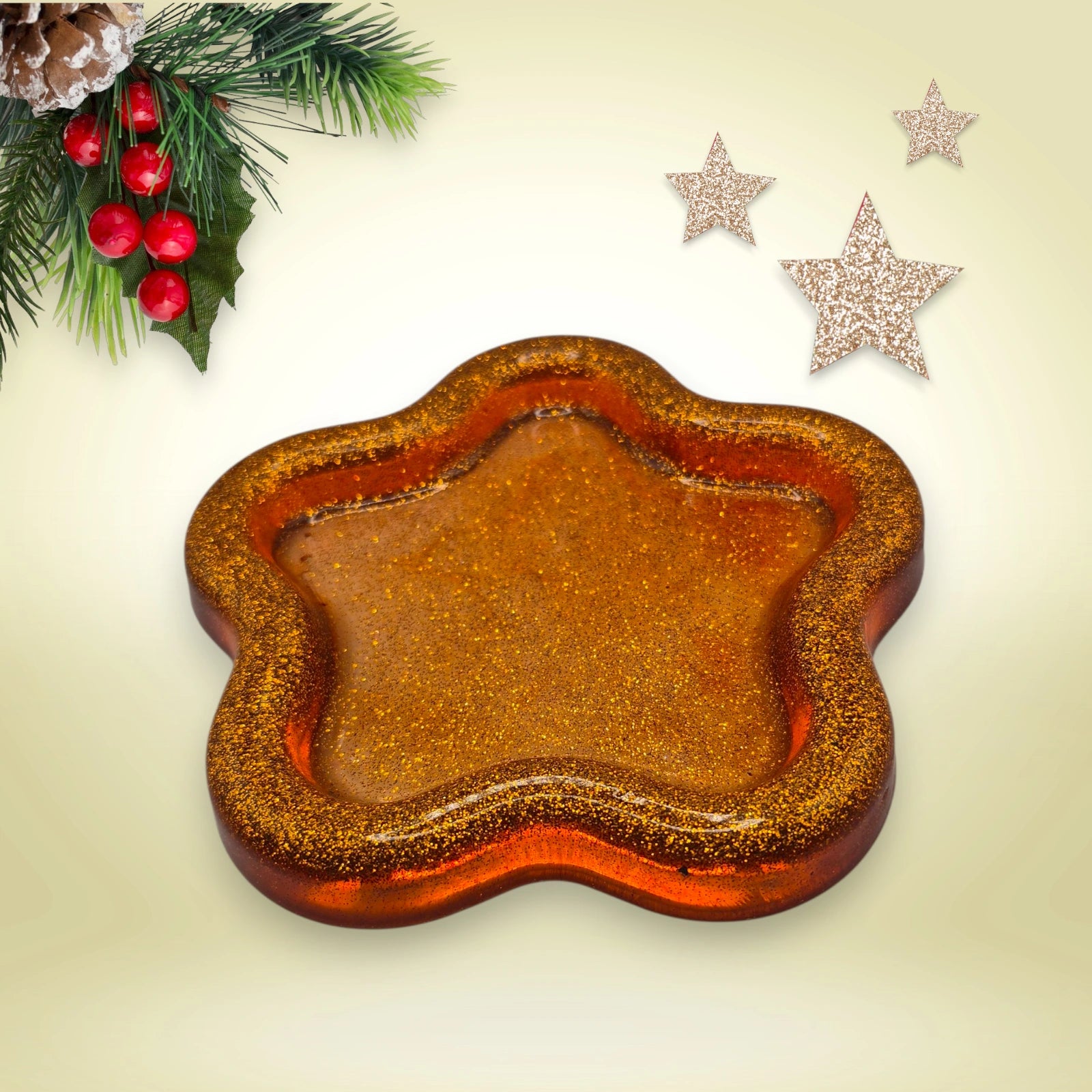 vide poche en forme d'étoile en résine pailletée cuivre posée sur un fond décoratif